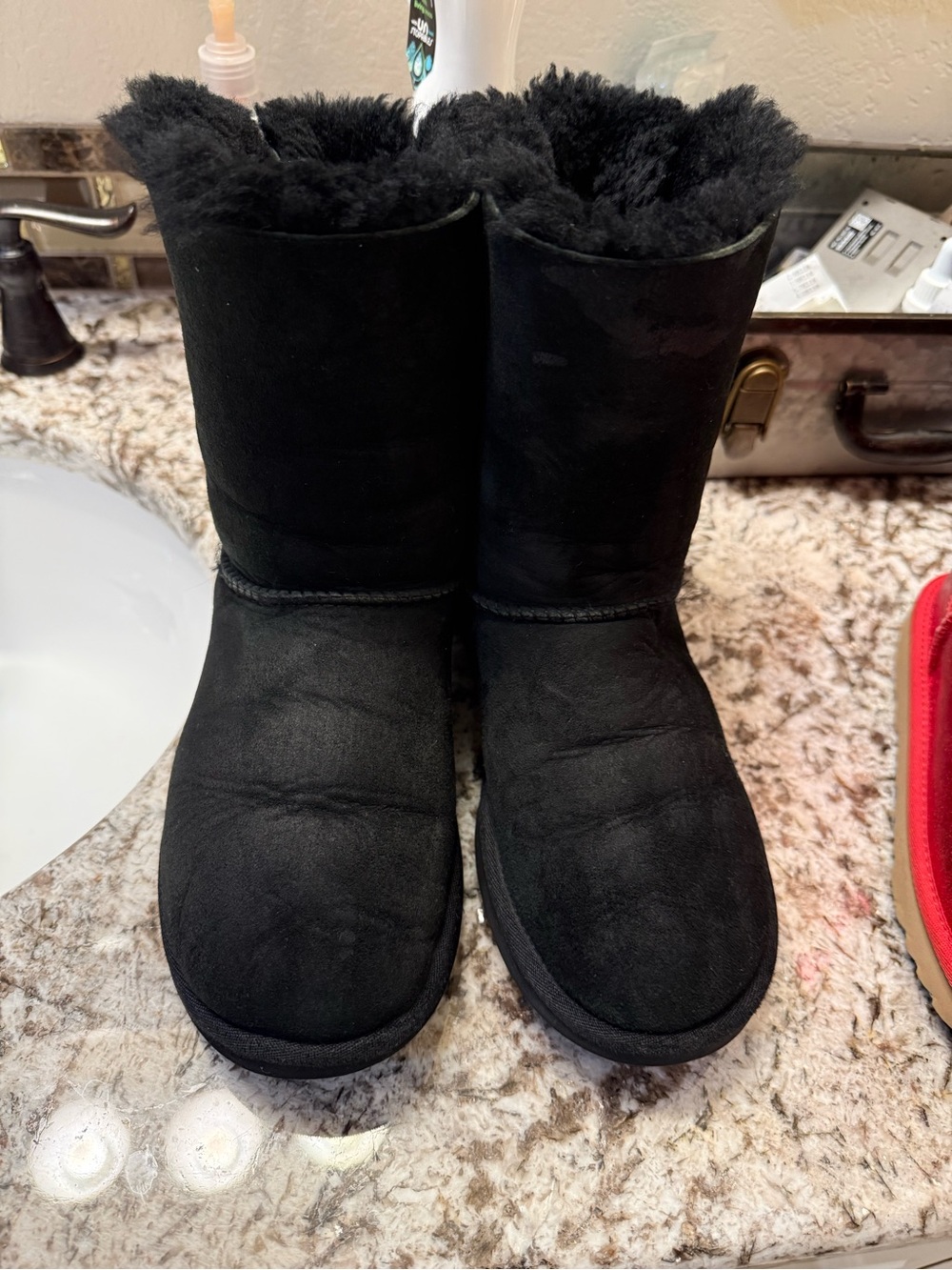 UGG women’s Classic Short Shearling Boots in Black